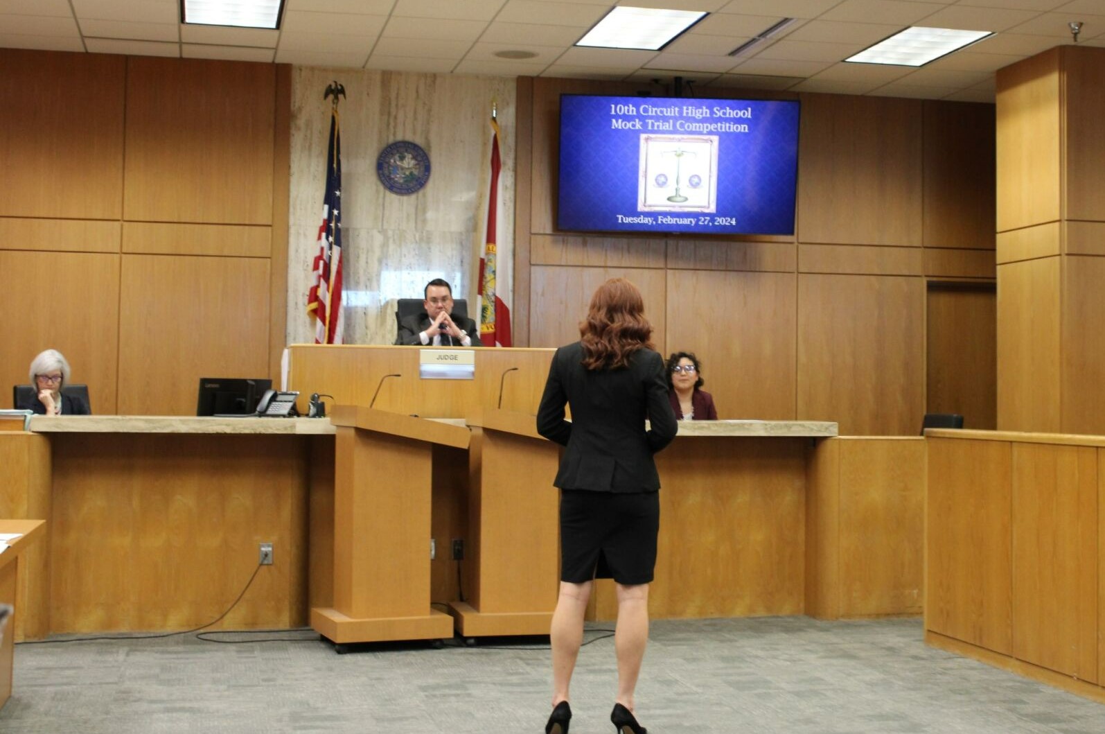 Student standing before Judge for PM testimony