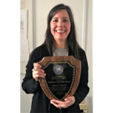 Belated Congratulations to 2021 Justice Award Winner Denise Wilcox - holding plaque