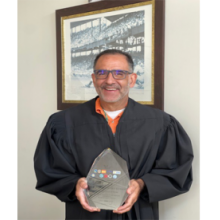 10th Judicial Circuit Judge Peter F. Estrada holding award at the Third Annual Florida Jurist