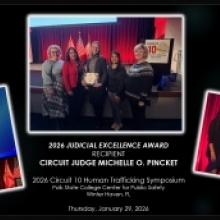 Circuit Judge Pincket holding her Judicial Excellence Award with Director of Case Management, Jodi Hawthorne, standing to her right, and Case Management Specialist, Dubelsa Lorente, and Juvenile Program Coordinator, Heather Pemberton, standing to her left. 